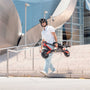 Man carrying a folded electric scooter down city steps, showcasing urban mobility and convenience with Hiboy scooters from Urban Electrica.