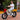 Man riding a white Hiboy EX6F Foldable Electric Bike with fat tires on a brick path.