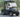 TrailMaster Taurus 50EV 4-seat electric golf cart with DOT light package, aluminum wheels, off-road tires, and digital dashboard.