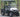 TrailMaster Taurus 50EV 4-seat electric golf cart with off-road tires, LED headlights, and rearview mirrors, parked outdoors.