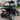 TrailMaster Blazer i200R Electric Go Kart with 48V lithium battery parked in a lot, showcasing its robust design and rear suspension.