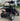 TrailMaster Blazer i200R Electric Go Kart with 48V lithium battery parked in a lot, showcasing its robust design and rear suspension.
