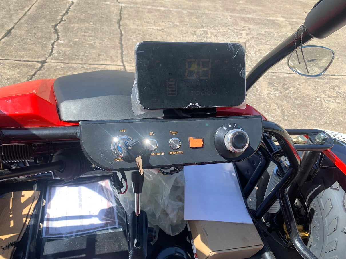 Control panel of TrailMaster Blazer i2K Electric Go Kart showing dashboard features and controls for an advanced driving experience.