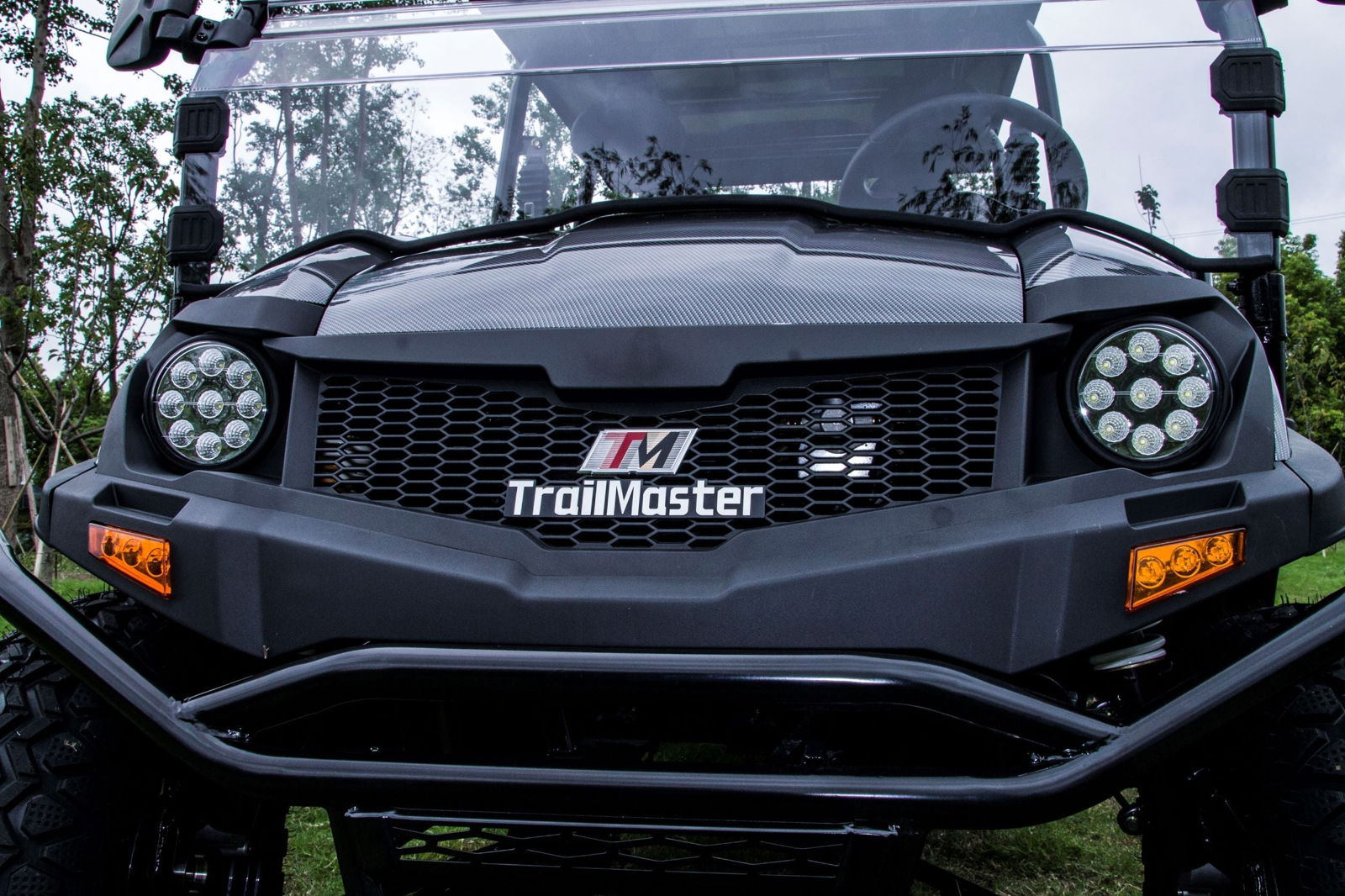 Front view of TrailMaster Taurus 80ED-GV 6-seat electric golf cart with rugged design and 72-volt power system.