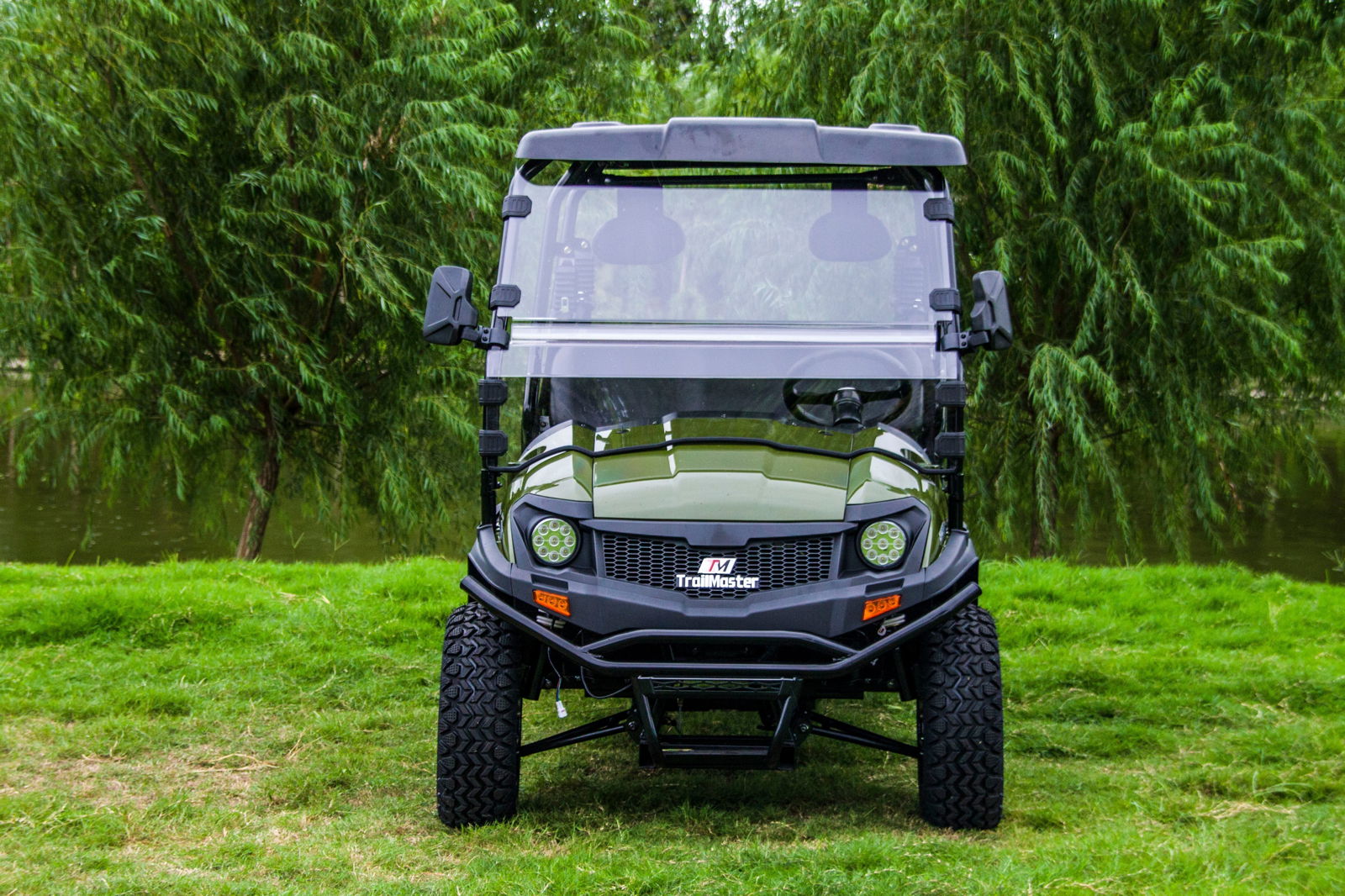 Front view of TrailMaster Taurus 80ED-U 4-Seat Electric Golf Cart with dump bed, featuring 72V motor, aluminum alloy wheels, and off-road tires.