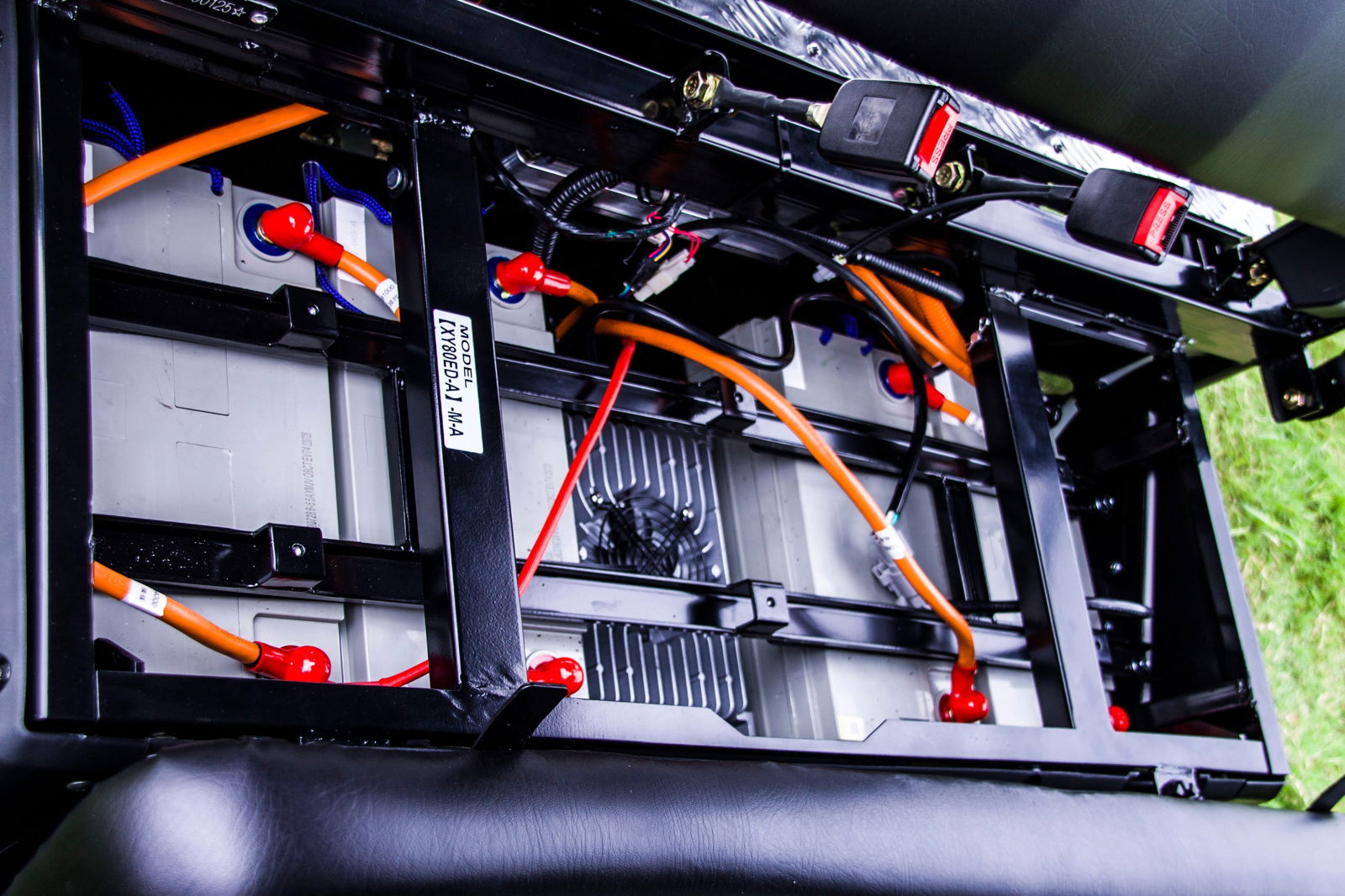 TrailMaster Taurus 80ED-U electric golf cart battery compartment with orange wiring and 72V power system under seat view.