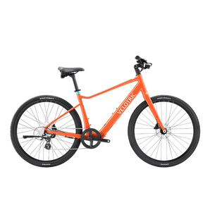 The Velotric T1 ST in orange, featuring a 350W Motor and 70 miles of pedal-assist range.
